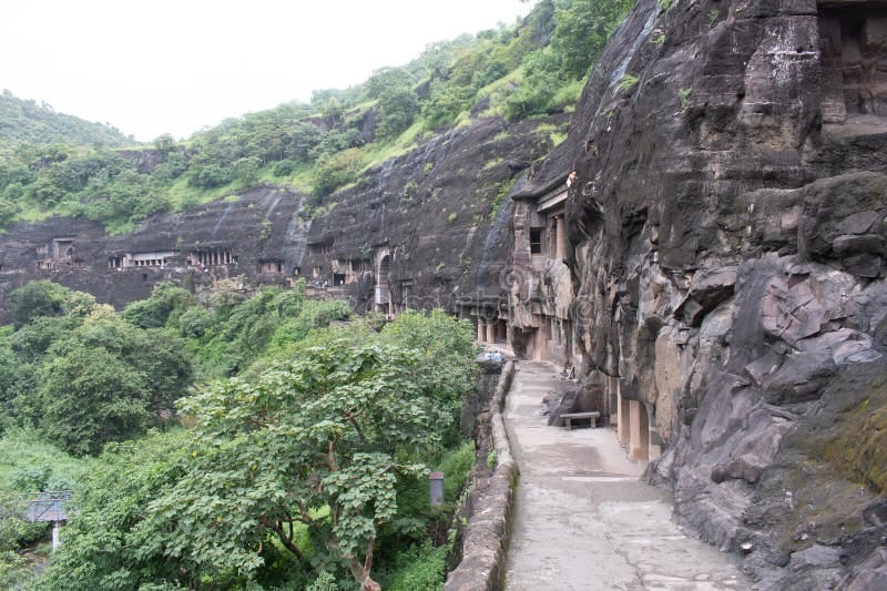 Ajanta Caves carved into a horseshoe-shaped cliff above the Waghora River