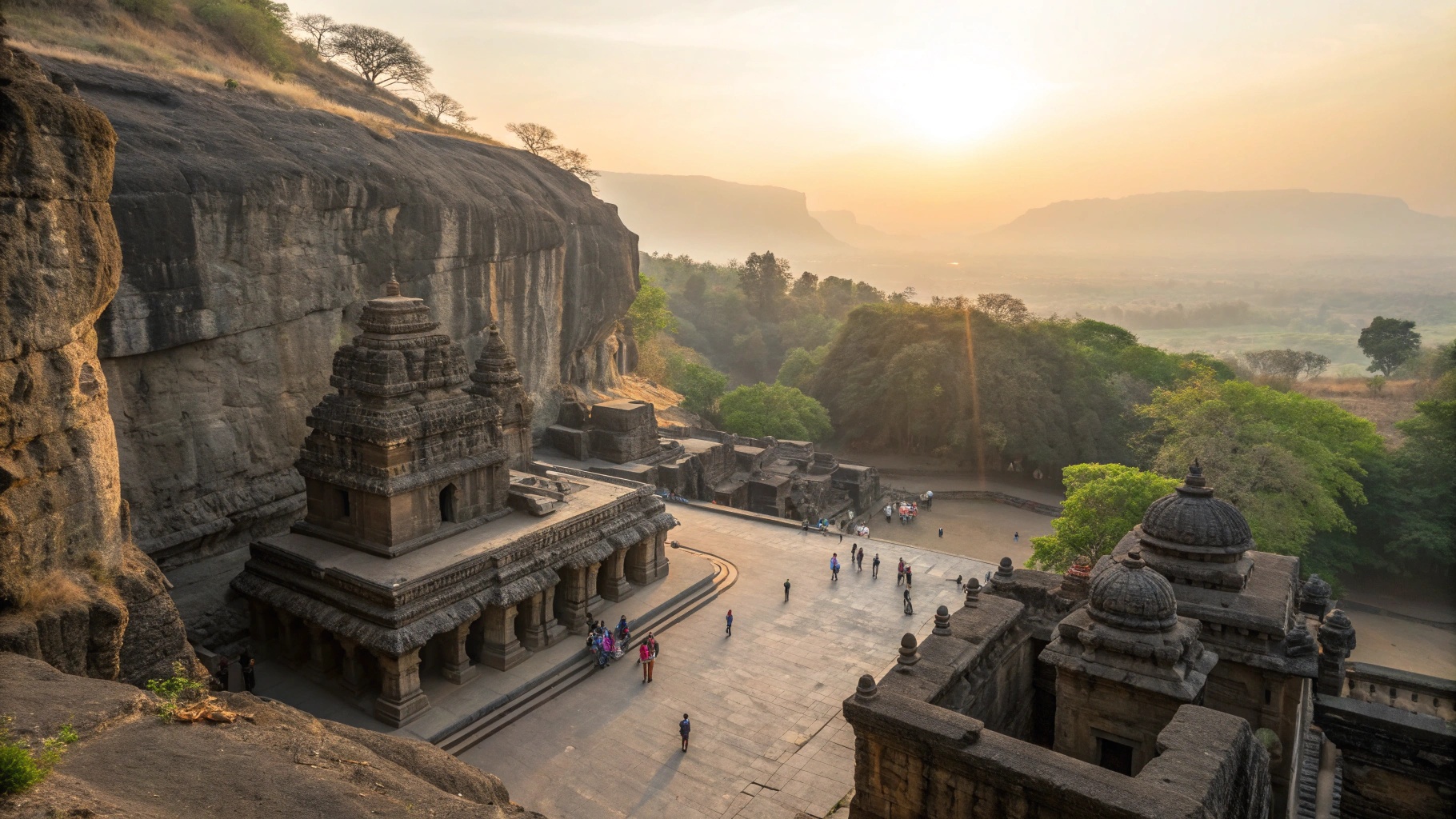 Panoramic view of Ellora Caves with Kailasa Temple at sunrise, warm Deccan light