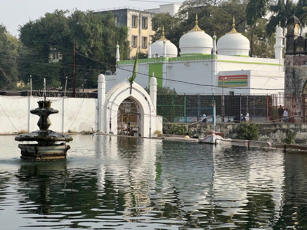 Panchakki, a 17th-century stone water mill in Aurangabad with a reflective pond